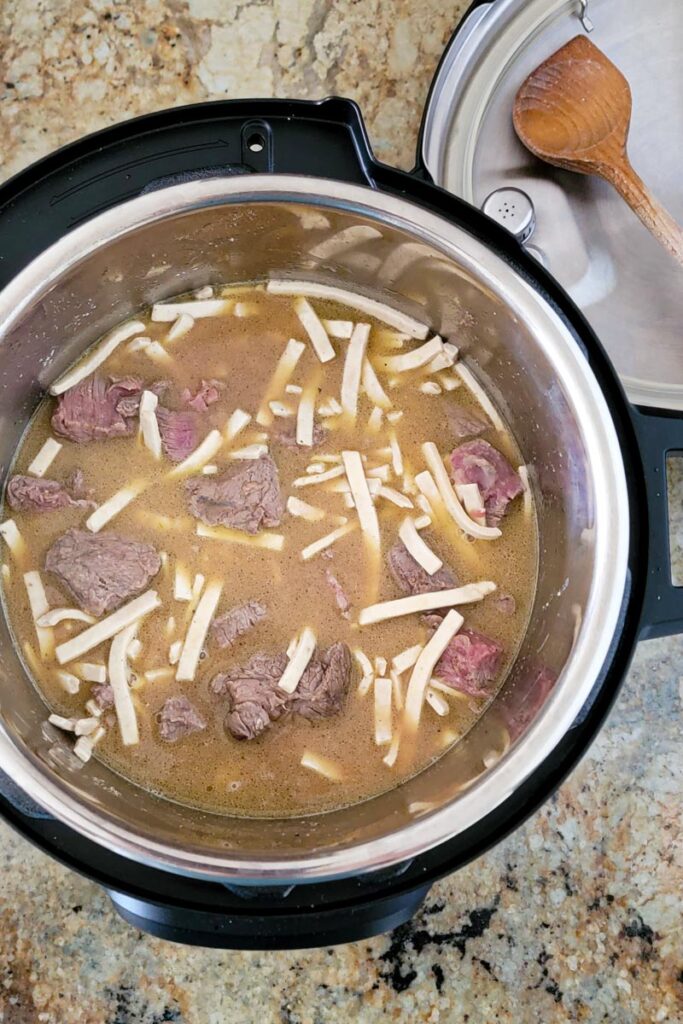 inside of instant pot with all ingredients stirred together.