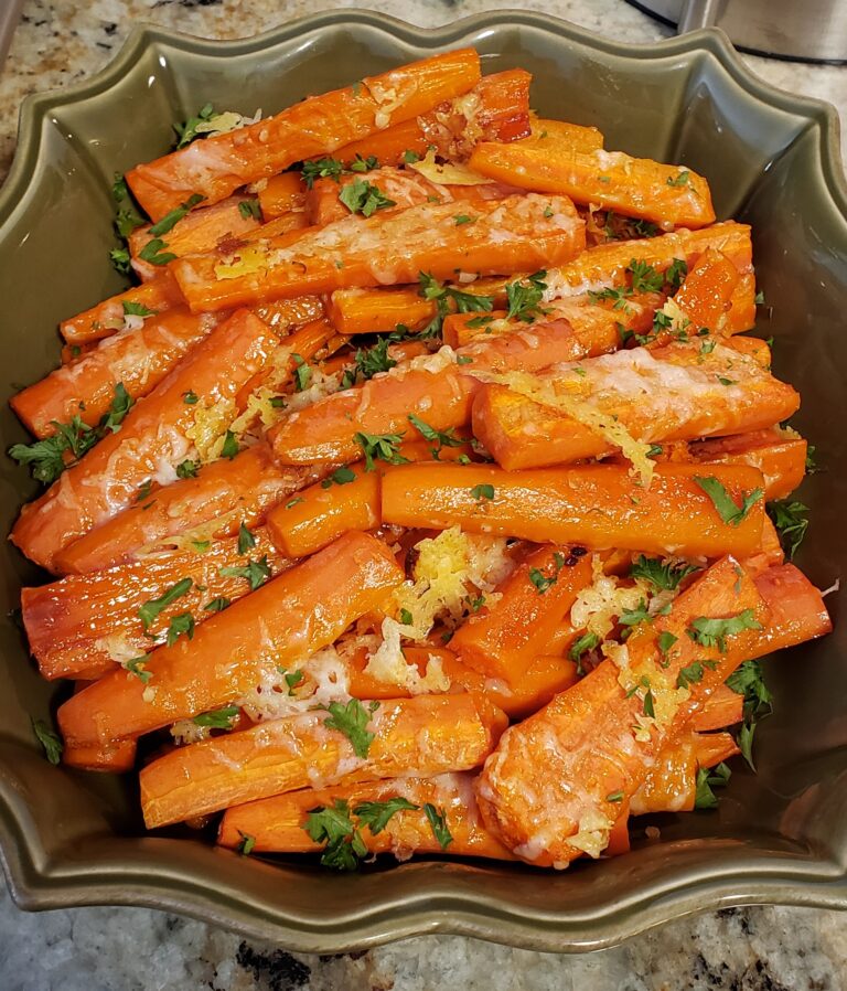 green platter with roasted garlic parmesan carrots.